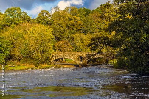 A view towards the bridge at Cenarth, Wales after heavy rainfall photo