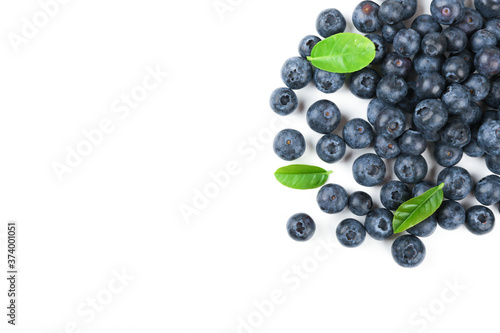 blueberry berries with green leaves on white background top view with copy space