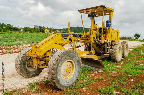 Motor Grader Parked On Road Construction Site