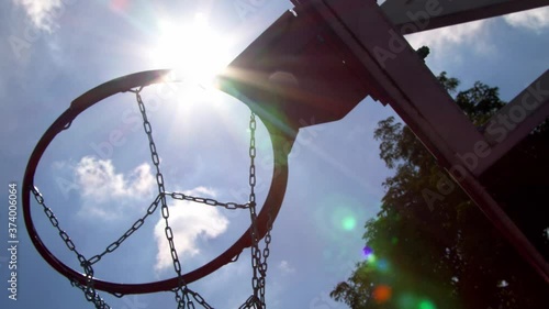 Basketball hoop in sunny day in 4k
