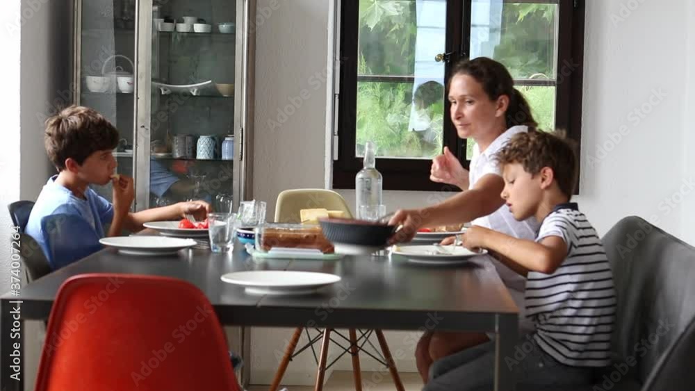 Candid family at morning breakfast table Candid family at morning breakfast table