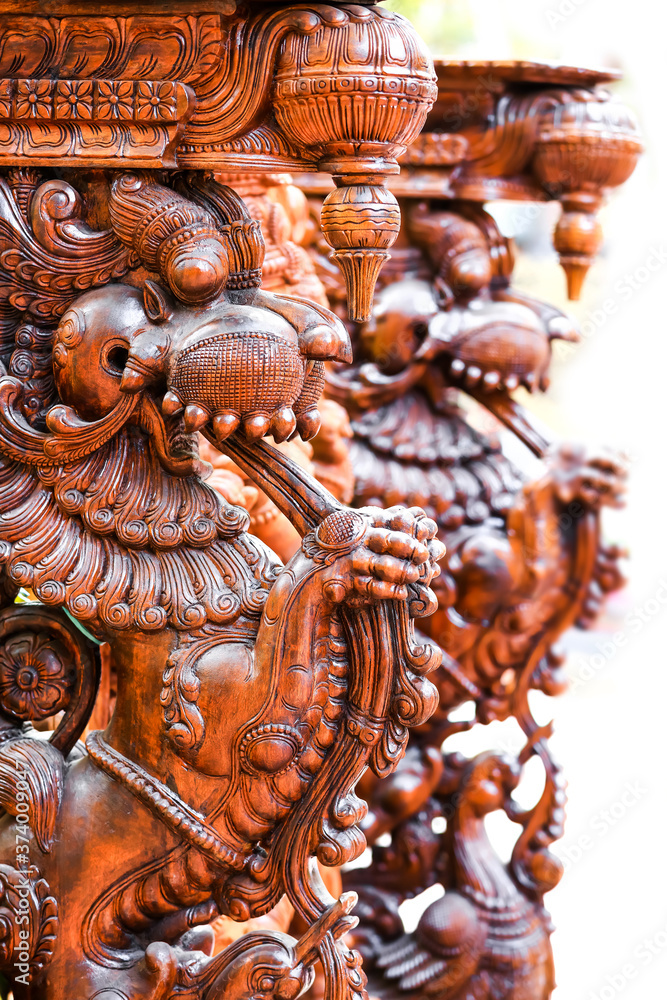 Close up shot of very detailed Hindu wood carved gods