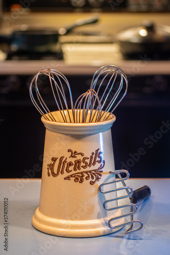 Фотография An earthen pot holds my wire whisks and potato smasher in my kitchen in Windsor