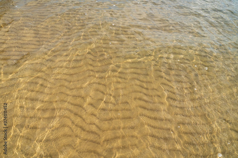 Sandy bottom of lake through clear and clean water Sandy bottom of lake through clear and clean water