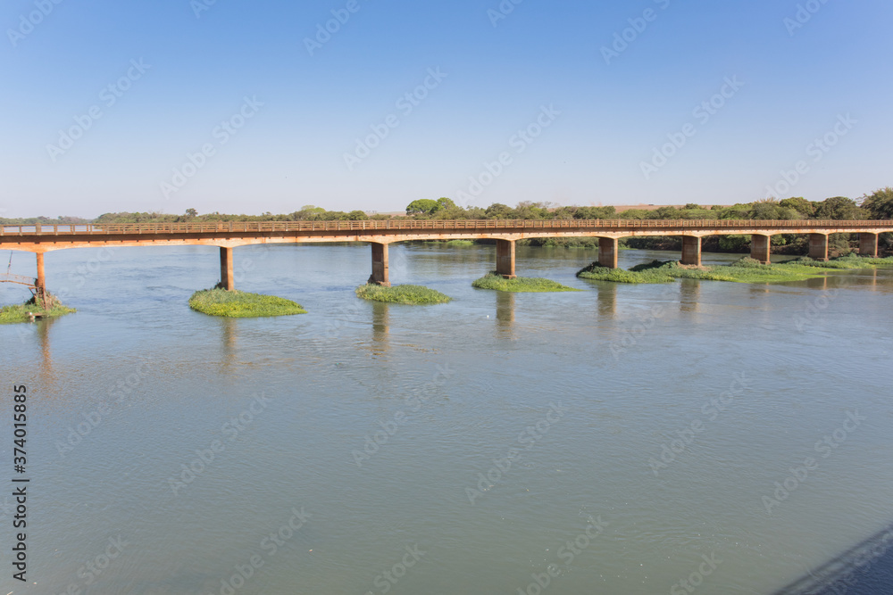 Large river with preserved banks on a sunny day - Rio Pardo - Barretos - Guaíra - São Paulo - Brazil