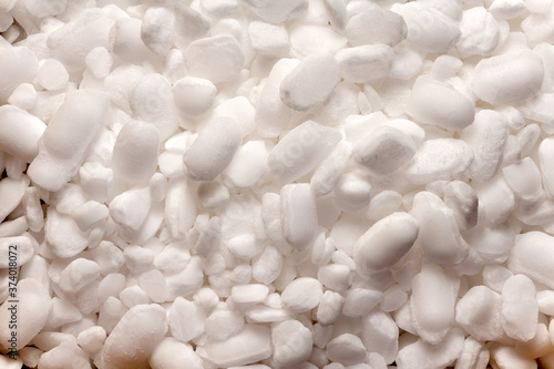 Macro shot of pellets of salt used for water softener.