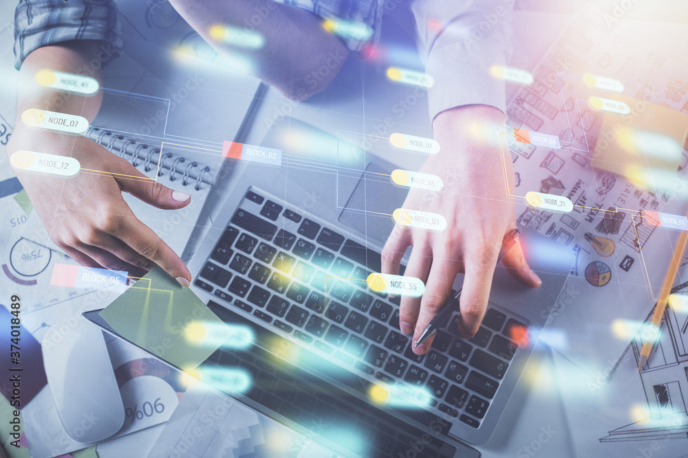 Double exposure of man and woman working together and data theme hologram drawing. Computer background. Top View. Double exposure of man and woman working together and data theme hologram drawing. Computer background. Top View.