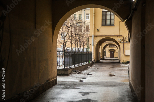 Arch in the entrance courtyard of an old apartment building in St. Petersburg