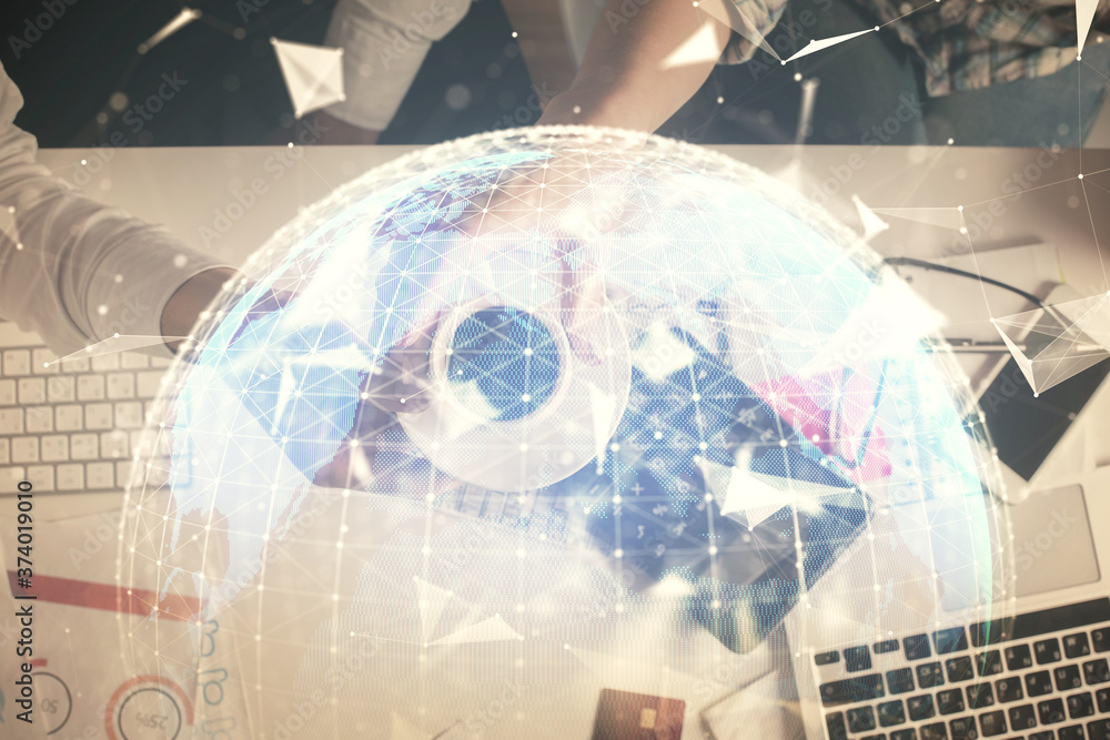 Double exposure of man and woman working together and business theme hologram drawing. Computer background. Top View. Double exposure of man and woman working together and business theme hologram drawing. Computer background. Top View.