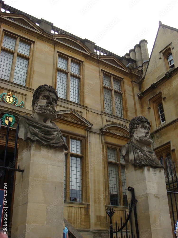statue in front of old building in Oxford