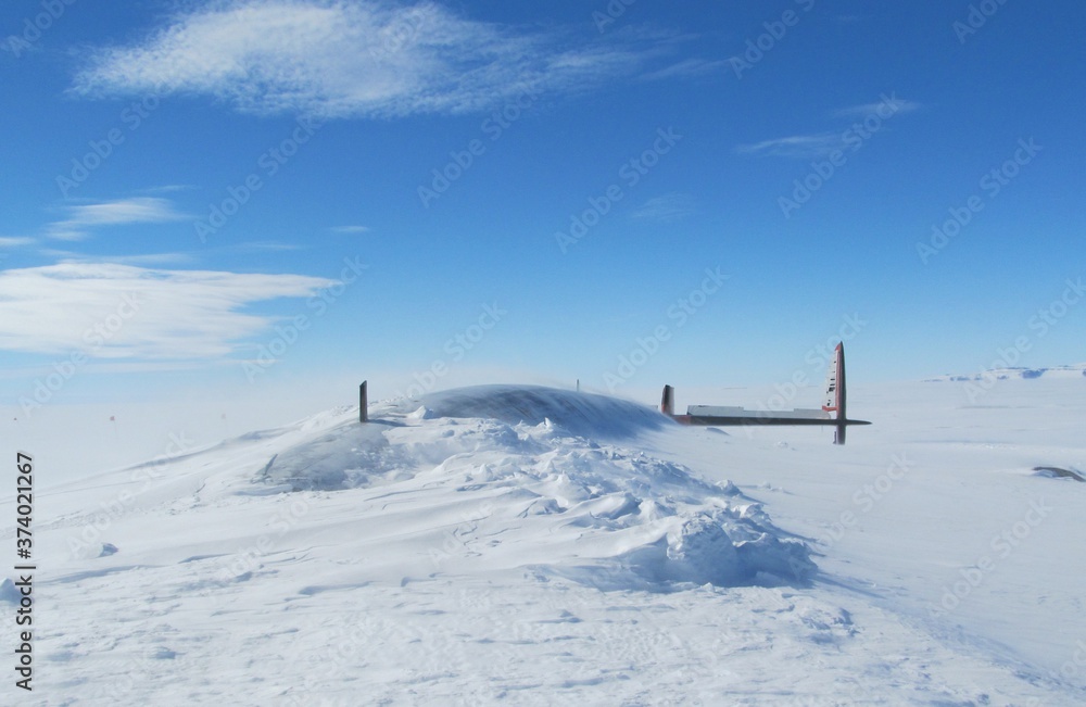 Pegasus Plane Crash Site with fuselage and tail above snowline, buried in Antarctica Pegasus Plane Crash Site with fuselage and tail above snowline, buried in Antarctica