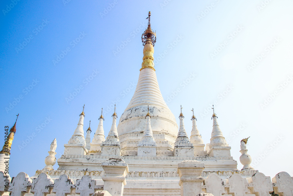 Beautiful ancient white Buddhist temple and pagodas Migun Myanmar Burma