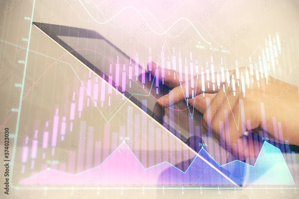 Multi exposure of man's hands holding and using a digital phone and forex graph drawing. Financial market concept. Multi exposure of man's hands holding and using a digital phone and forex graph drawing. Financial market concept.