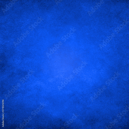 Dark blue grunge paper texture background with darkened edges and glowing center.