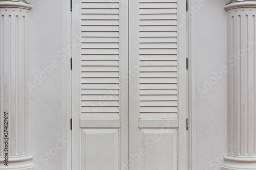 Vintage white door with white background.
