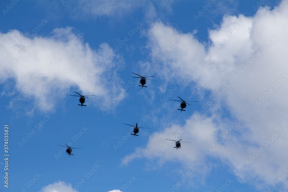 Mexican Air Force helicopters fly over the municipality of Nextlalpan as part of flying excercises.