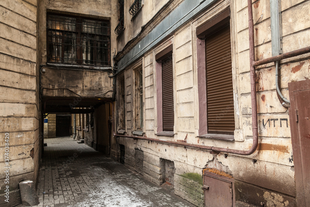 Arch in the entrance courtyard of an old apartment building in St. Petersburg Arch in the entrance courtyard of an old apartment building in St. Petersburg