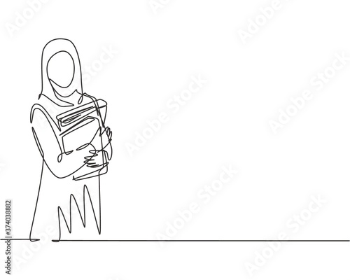 Single continuous line drawing of young female muslim businesswoman carrying annual report books to business meeting. Arab middle east cloth hijab and veil. One line draw design vector illustration photo