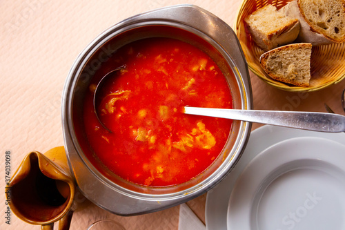 Hot Callos a la gallega stew - traditional dish of Galician cuisine. Rich pork tripe broth with vegetables