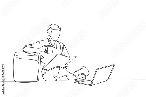 One continuous single line drawing of young happy marketing manager leaning his body to sofa ottoman while reading annual report on tablet. Drinking coffee or tea concept design vector illustration