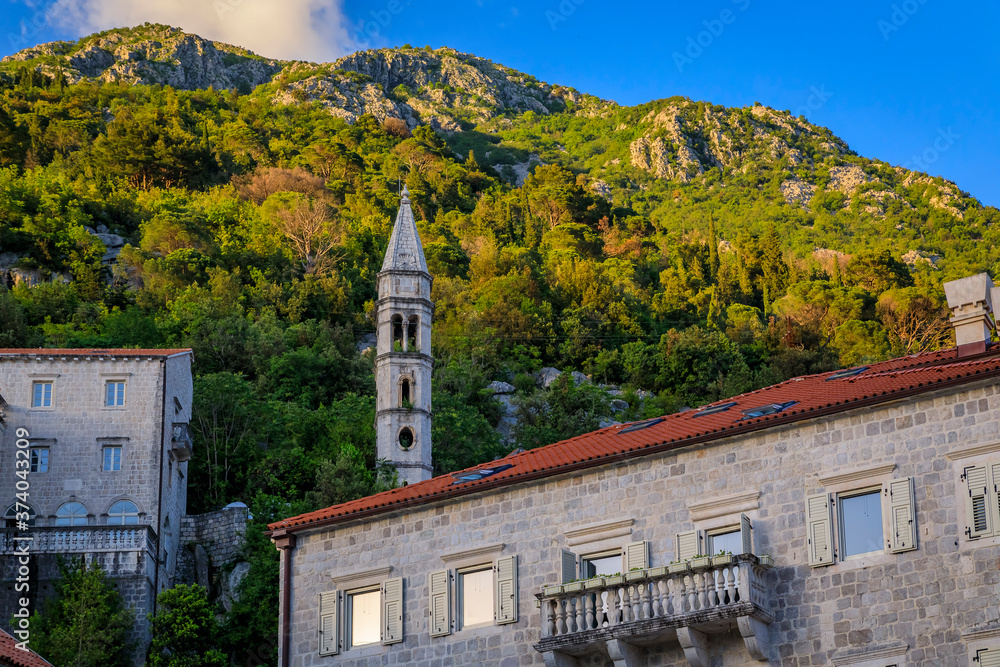 Kapela Sv Ivana Evandeliste or St. Ivan Evangelist Chapel in Perast Kotor Bay, Montenegro with mountains in background