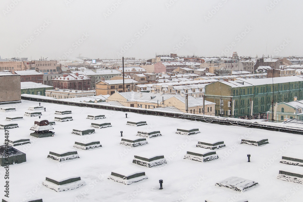 Rooftop of industrial building covered with snow in Saint Petersburg