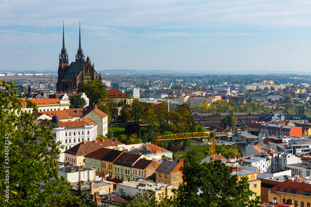 Obraz premium Autumn cityscape of Brno with famous gothic Cathedral of Saints Peter and Paul on sunny day, Czech Republic
