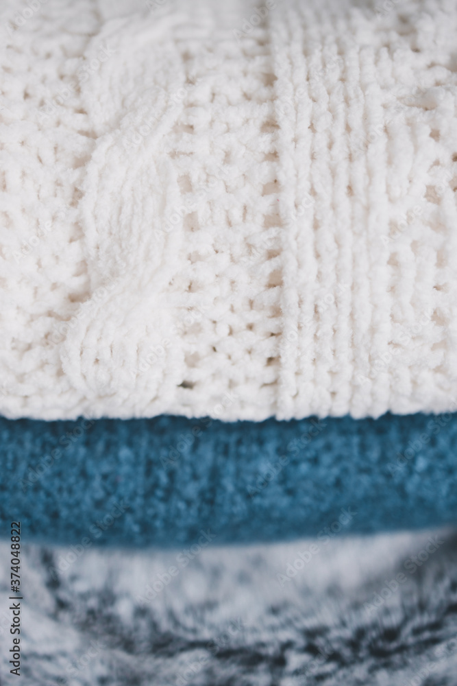 winter lifestyle concept, soft and fluffy blankets and throws stack winter lifestyle concept, soft and fluffy blankets and throws stack