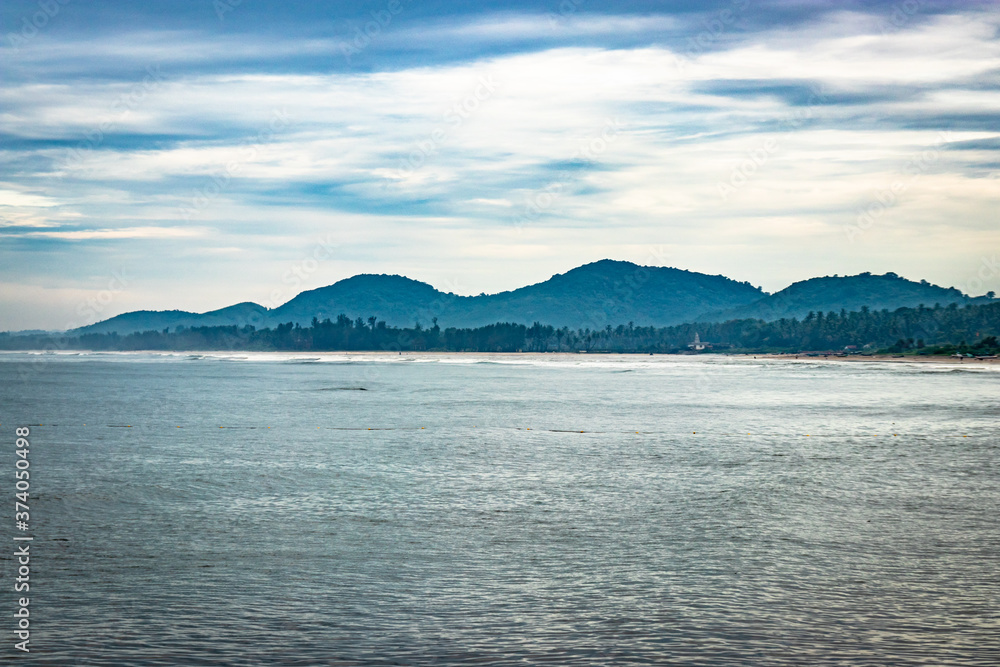 Obraz premium sea horizon with mountain shadow at early in the morning from flat angle