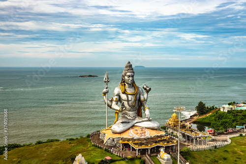 shiva statue isolated at murdeshwar temple aerial shots with arabian sea in the backdrop