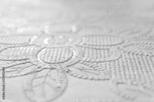 white flower emboss background picture with focus point, beautiful clean flat background with flower emboss pattern, texture of emboss background white color, traditional vintage white background