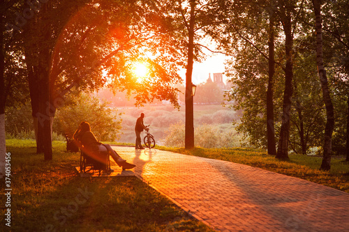 Fototapeta Naklejka Na Ścianę i Meble -  Sunset silhouette of man with bicycle