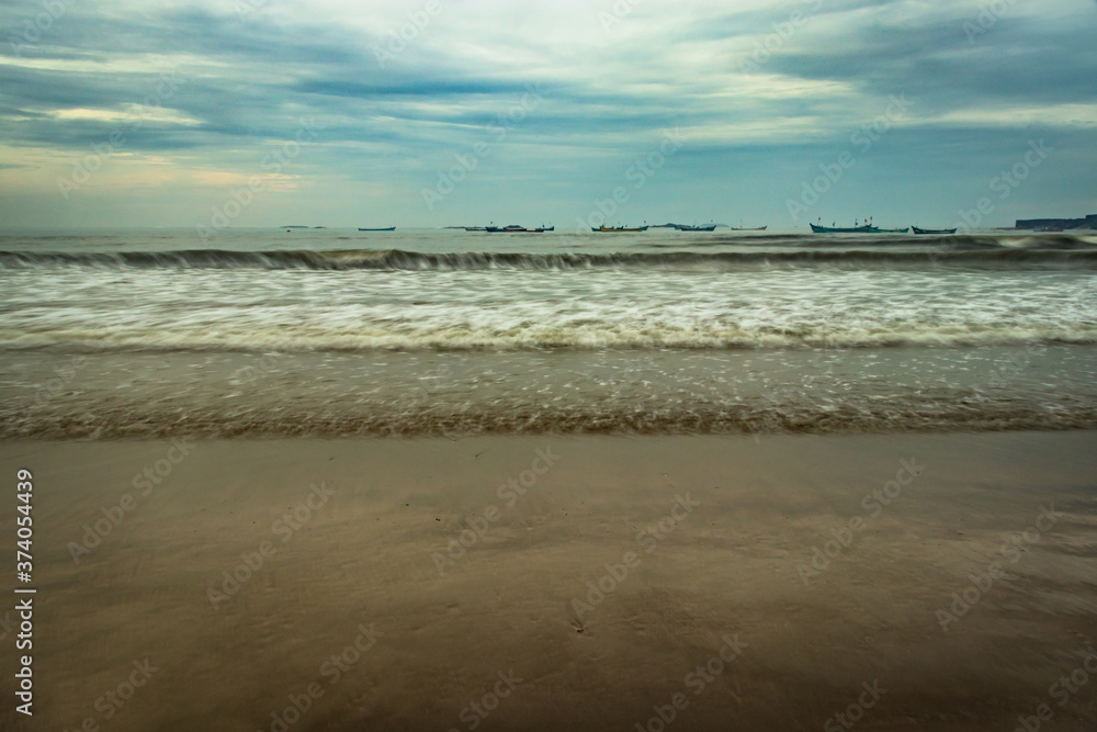 beach view with sea waves at early in the morning from low angle beach view with sea waves at early in the morning from low angle