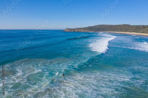 Aerial view surfers at Alexandra Bay, Noosa National Park © Janelle