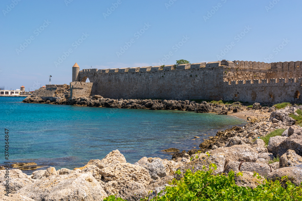 Medieval walls of Rhodes town at the port of Mandrakia. Rhodes island, Greece