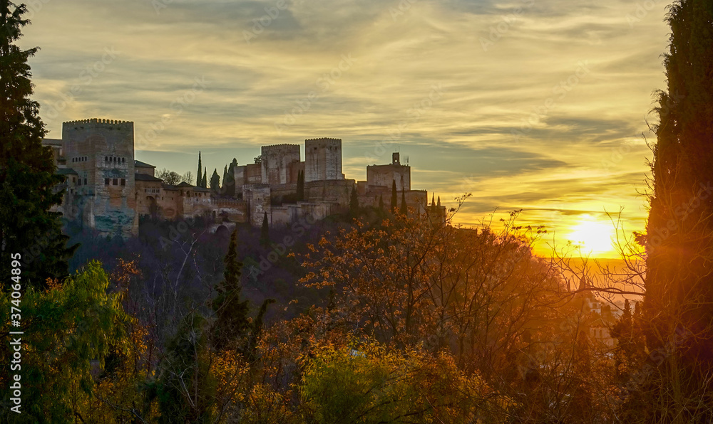 Sunset in Granada. The fortress and arabic palace complex of Alhambra, Spain