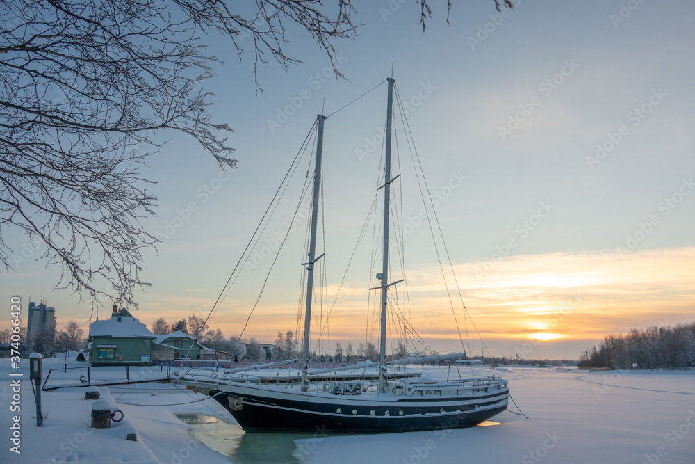 Winter view to port of Raahe, Finland, at sunset Winter view to port of Raahe, Finland, at sunset