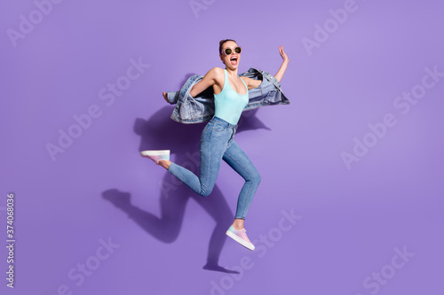 Full length body size view of nice attractive pretty funny girlish free cheerful girl jumping having fun weekend isolated on bright vivid shine vibrant lilac purple violet color background