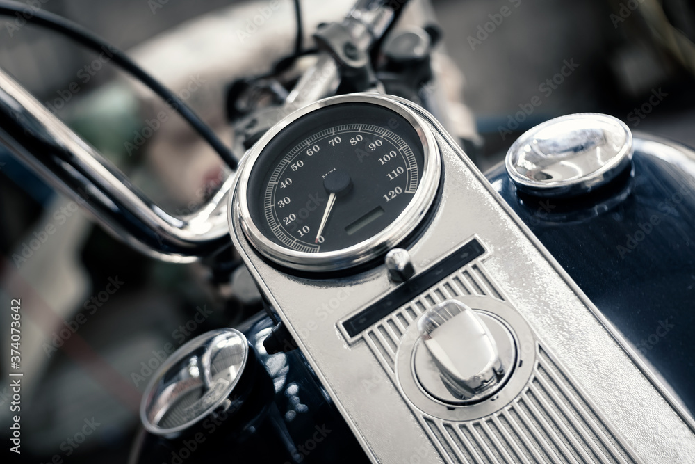 details of analog speedometer on vintage big bike, shallow depth of field