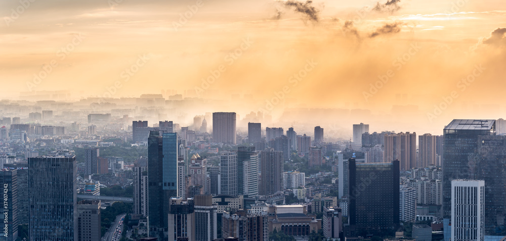 Chengdu backlight skyline aerial view with clouds on the city, Sichuan province, China Chengdu backlight skyline aerial view with clouds on the city, Sichuan province, China