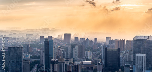 Chengdu backlight skyline aerial view with clouds on the city, Sichuan province, China