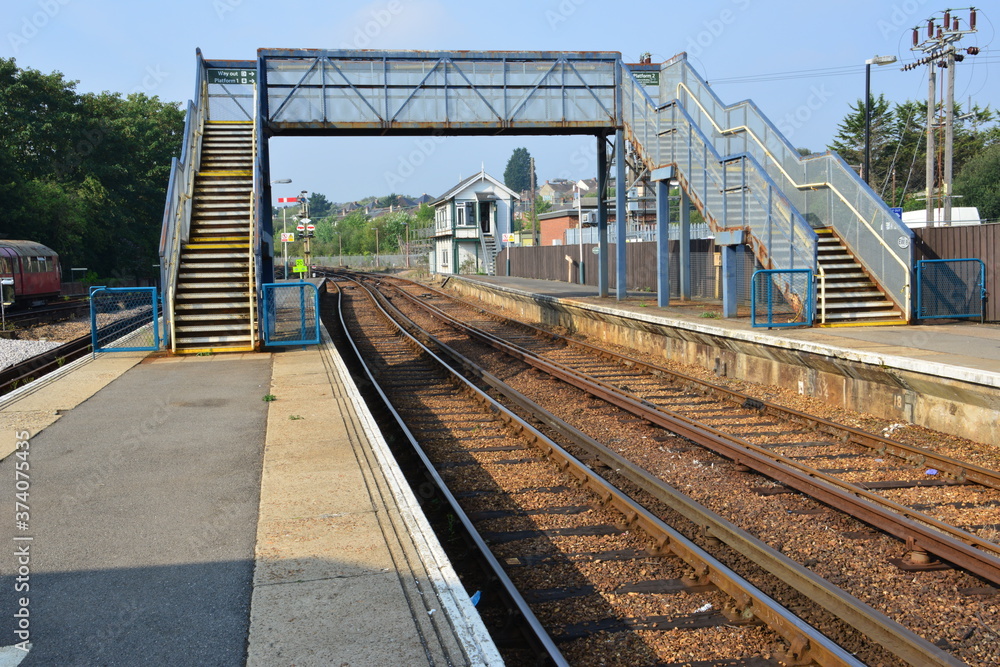 Fototapeta premium Iron footbridge crossing at a station in the Isle of Wight.