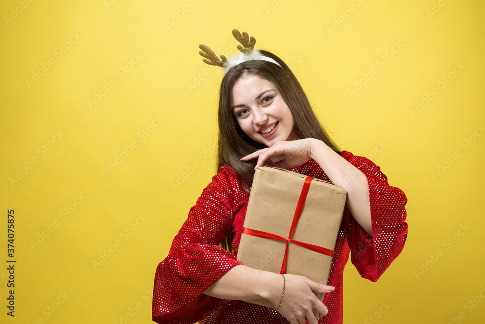 Close-up portrait of a girl with gifts in her hands. Close-up portrait of a girl with gifts in her hands.