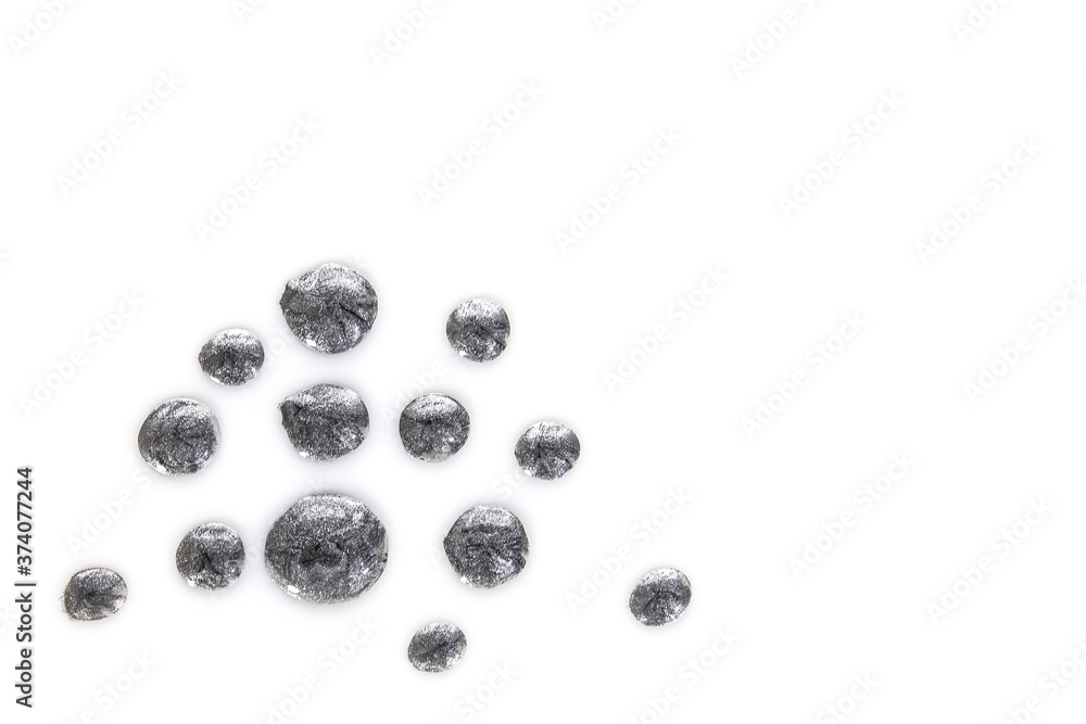 blot of silver sparkling nail polish isolated on white background. Top view blot of silver sparkling nail polish isolated on white background. Top view