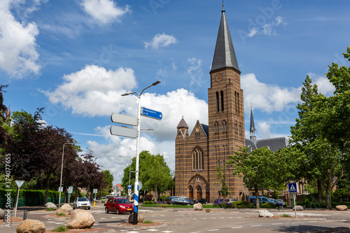 The historical Roman Catholic Sint-Pancratius church on the crossing of the Hoofdstraat and the Parklaan in the South-holland village of Sassenheim in the Netherlands.