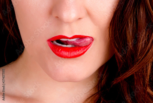 Girl licking her lip close-up