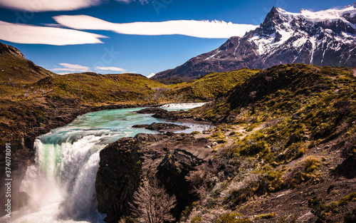 Salto Grande in Torres del Paine National Park, Chile. Waterfall in Patagonia, beautiful colors and snowy mountains with turquoise river.