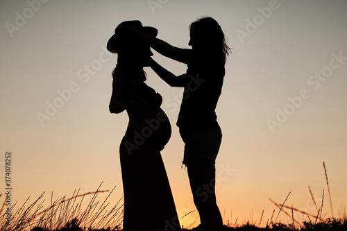 Canvas Print Mesmerizing shot of a lovely pregnant couple - lesbian family concept
