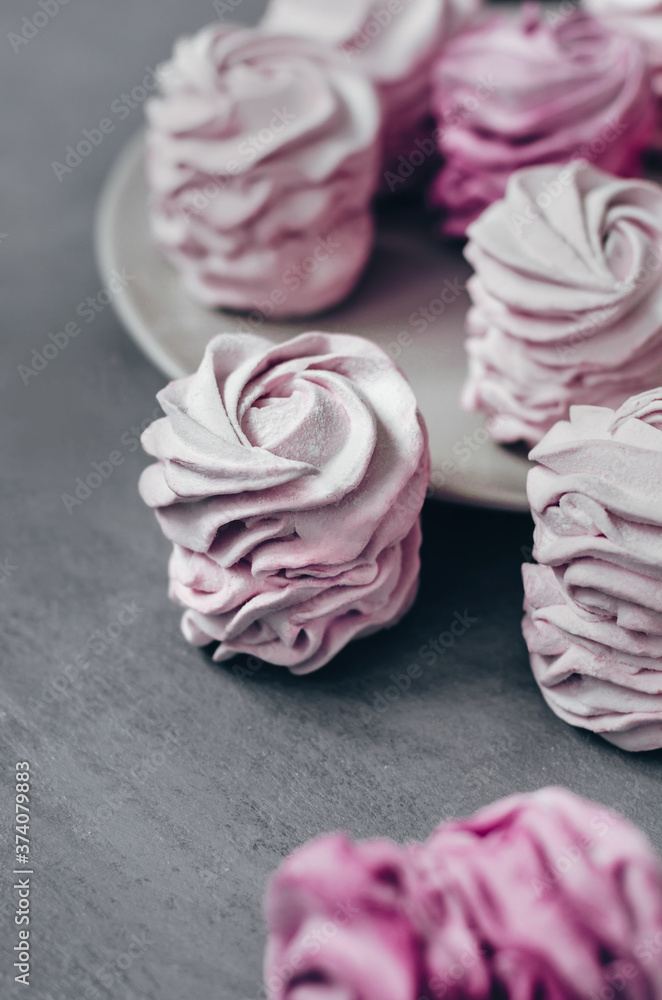 Colorful Air marshmallows on gray background. Sweet zephyr