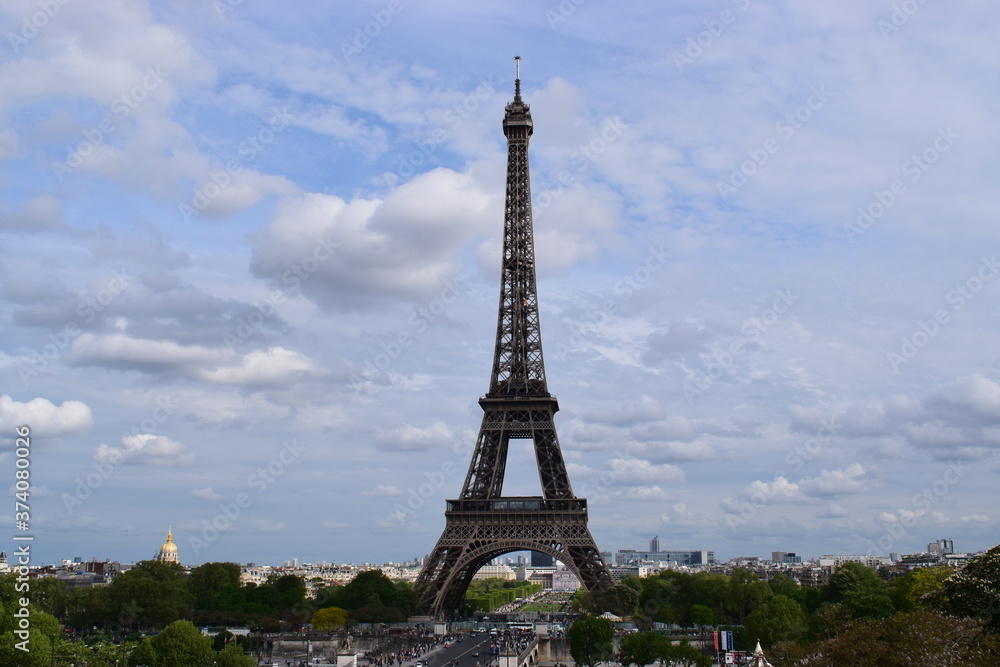 PARIS, FRANCE - APRIL 28, 2018: Beautiful view of the Eiffel Tower (Tour Eiffel) in a sunny spring day - Breathtaking view of the most known monument of Paris